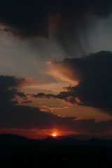 Sunset with dark clouds illuminated